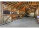 Well-maintained horse stalls featuring wooden doors, ample space, and a clean, organized interior at 12714 Tyler Run Ave, Odessa, FL 33556