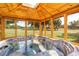 Relaxing hot tub inside a wood gazebo with views of the horse pasture and surrounding greenery at 12714 Tyler Run Ave, Odessa, FL 33556