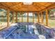 Relaxing hot tub inside a wood gazebo with views of the horse pasture and surrounding greenery at 12714 Tyler Run Ave, Odessa, FL 33556