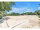 Spacious outdoor sand arena featuring cones, providing ample room for equestrian activities and training at 12714 Tyler Run Ave, Odessa, FL 33556