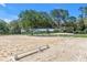 Outdoor sand arena with large mirrors and well-placed training cones, surrounded by manicured grounds at 12714 Tyler Run Ave, Odessa, FL 33556