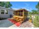Inviting outdoor bar features ample seating on a brick patio, perfect for entertaining guests at 12714 Tyler Run Ave, Odessa, FL 33556