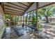 Convenient barn wash rack, equipped with lush landscaping creating a refreshing space for horse care and grooming at 12714 Tyler Run Ave, Odessa, FL 33556