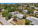 Gorgeous aerial view of property with a screened-in pool in a tropical setting at 139 Adair Ave, Sarasota, FL 34243