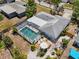 Property aerial view featuring a screened pool, patio and landscaping at 139 Adair Ave, Sarasota, FL 34243
