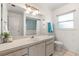 Bright bathroom with a neutral vanity, updated lighting, and a shower/tub combo at 139 Adair Ave, Sarasota, FL 34243