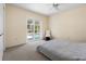 Bedroom featuring a ceiling fan, a sliding glass door to a pool, neutral-toned walls, and carpeted floors at 139 Adair Ave, Sarasota, FL 34243