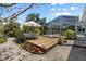 Charming outdoor space with a wooden deck, patio furniture, and a screened-in pool at 139 Adair Ave, Sarasota, FL 34243