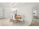 Well-lit dining room featuring a wooden table and white chairs at 139 Adair Ave, Sarasota, FL 34243