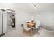 Bright dining area with adjacent laundry room and modern lighting at 139 Adair Ave, Sarasota, FL 34243