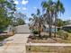 Wide front exterior view of a well kept house with a large front lawn at 139 Adair Ave, Sarasota, FL 34243