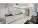 Bright kitchen featuring white cabinets, black counters, and tile flooring at 139 Adair Ave, Sarasota, FL 34243