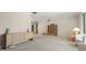 Large living room with minimalist decor including natural wood cabinet and comfortable seating at 139 Adair Ave, Sarasota, FL 34243