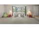 Cozy living room with bay windows, comfortable seating, and ample natural light at 139 Adair Ave, Sarasota, FL 34243