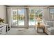 Bright living room with sliding glass doors leading to the pool area at 139 Adair Ave, Sarasota, FL 34243