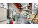 Spacious garage featuring a water heater, storage, and ample workspace for various projects and storage solutions at 14 Braden Castle Dr, Bradenton, FL 34208