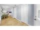 Entryway with white doors and tile flooring leading into a kitchen and dining area at 14 Braden Castle Dr, Bradenton, FL 34208