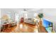 Cozy living room featuring hardwood floors, white walls, comfortable furniture, and natural light at 14 Braden Castle Dr, Bradenton, FL 34208