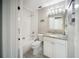 Bright bathroom features white subway tile in the shower/tub combo and a granite vanity countertop at 16834 Toledo Blade Blvd, Port Charlotte, FL 33954