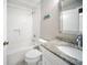 Bathroom with subway tile shower, granite vanity, and modern fixtures at 16834 Toledo Blade Blvd, Port Charlotte, FL 33954
