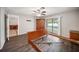 Bedroom features sliding glass doors to the pool, gray walls, and wood-look laminate flooring at 16834 Toledo Blade Blvd, Port Charlotte, FL 33954