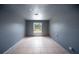 Empty bedroom features neutral walls, tiled floors, a window, and electrical outlets at 16834 Toledo Blade Blvd, Port Charlotte, FL 33954