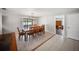 Dining area with a table and seating for eight with sliding glass doors to the pool at 16834 Toledo Blade Blvd, Port Charlotte, FL 33954