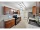 Bright kitchen boasts stainless steel appliances, black oven range, and granite countertops at 16834 Toledo Blade Blvd, Port Charlotte, FL 33954