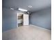 Room features neutral walls, tiled floors, a ceiling fan, and a utility room in the back at 16834 Toledo Blade Blvd, Port Charlotte, FL 33954