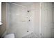 Clean and bright shower with white tile surround and chrome fixtures at 16834 Toledo Blade Blvd, Port Charlotte, FL 33954