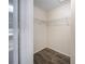 Empty walk-in closet with shelving and wood-look flooring at 16834 Toledo Blade Blvd, Port Charlotte, FL 33954