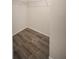 Empty walk-in closet with shelving and wood-look flooring at 16834 Toledo Blade Blvd, Port Charlotte, FL 33954