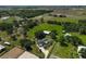 Sprawling estate featuring a home, barn, and acres of land, all captured in a scenic aerial view at 16918 Waterline Rd, Bradenton, FL 34212