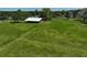 A large barn sits on a grassy field, perfect for agricultural pursuits and storage at 16918 Waterline Rd, Bradenton, FL 34212