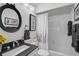 Modern bathroom featuring stylish fixtures, white tile, and a shower-tub combination at 16918 Waterline Rd, Bradenton, FL 34212