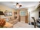 Comfortable bedroom with wood-look floors, a ceiling fan, and ample natural light at 16918 Waterline Rd, Bradenton, FL 34212