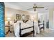 Comfortable bedroom featuring twin beds, side tables, and a ceiling fan at 16918 Waterline Rd, Bradenton, FL 34212