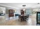 Stately dining room with period furniture, wainscoting, chandelier and large table at 16918 Waterline Rd, Bradenton, FL 34212
