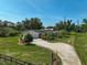 Expansive ranch-style home featuring a white gravel driveway and well-maintained landscaping at 16918 Waterline Rd, Bradenton, FL 34212