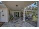Charming covered front porch featuring tile flooring and classic white columns at 16918 Waterline Rd, Bradenton, FL 34212