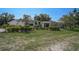 Charming home with an exquisitely landscaped front yard and mature trees at 16918 Waterline Rd, Bradenton, FL 34212