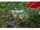 Lush garden with seating areas, mature plants, and garden decor at 16918 Waterline Rd, Bradenton, FL 34212