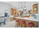 Open kitchen featuring a center island with barstool seating and tile flooring at 16918 Waterline Rd, Bradenton, FL 34212