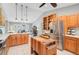 Bright kitchen features custom butcher block island, stainless steel appliances, and light wood cabinetry at 16918 Waterline Rd, Bradenton, FL 34212