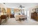 Large main bedroom features a tufted headboard bed, decorative windows, and plush carpet at 16918 Waterline Rd, Bradenton, FL 34212