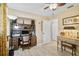 Well-lit home office with a built-in desk and wood-look floors at 16918 Waterline Rd, Bradenton, FL 34212