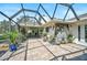Large open patio features lots of potted plants and an open view of the home and backyard at 16918 Waterline Rd, Bradenton, FL 34212