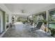 The covered patio offers peaceful views of the fenced backyard at 16918 Waterline Rd, Bradenton, FL 34212