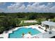Aerial view of pool, beach volleyball court, and clubhouse at 16943 Rosedown Gln, Parrish, FL 34219