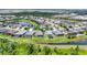Beautiful aerial view of a residential area with ponds and well-manicured lawns at 16943 Rosedown Gln, Parrish, FL 34219